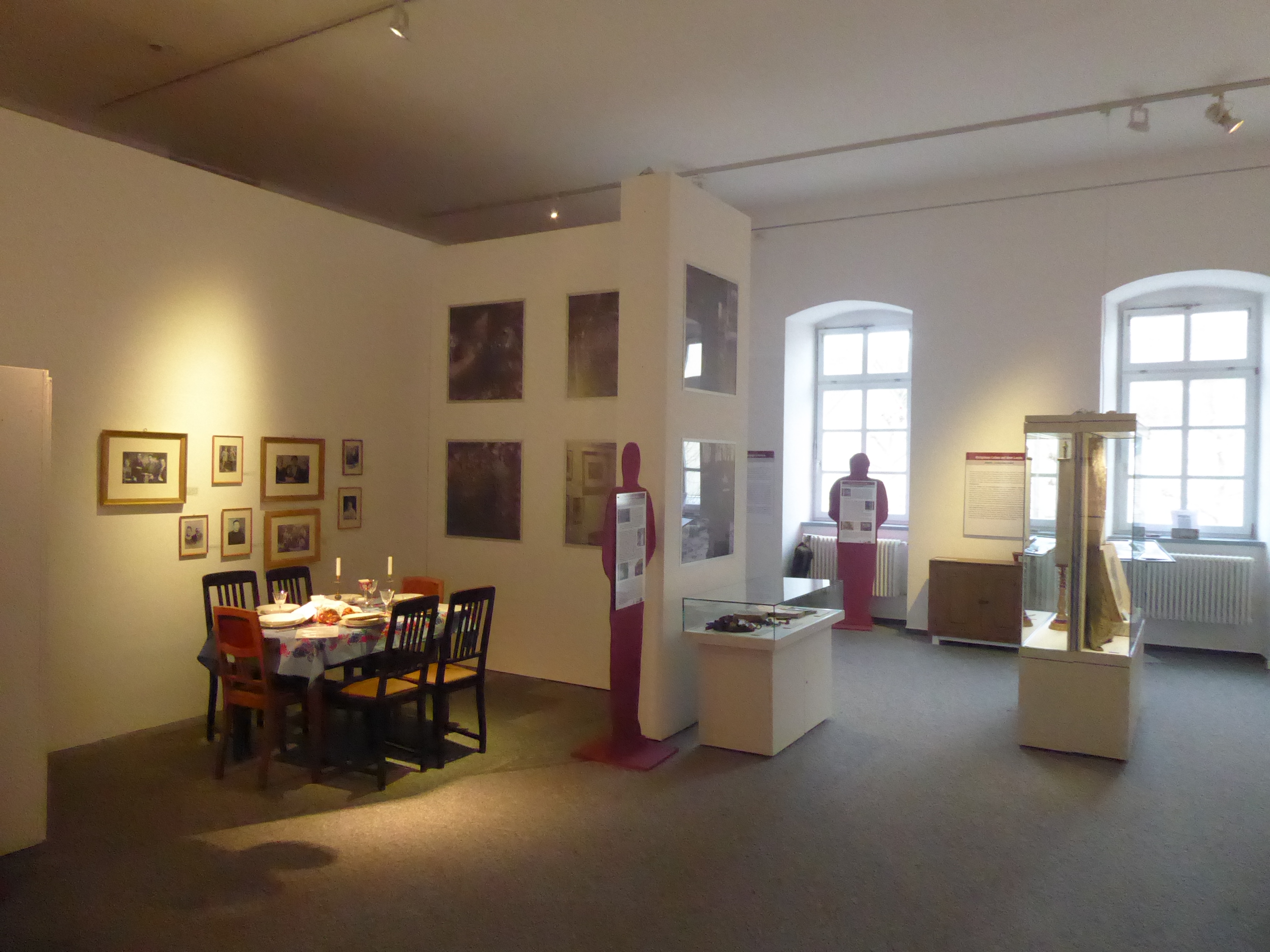Room 1: A Schabbath table, surrounded by historical photos of Hunsrück Jews